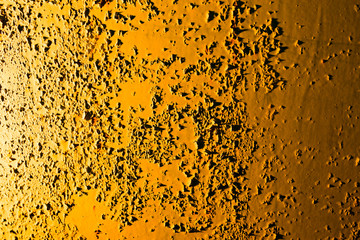 Old rusty metal in golden light as background