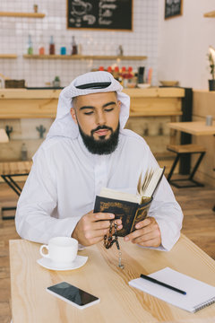 Muslim Man Reading Quran