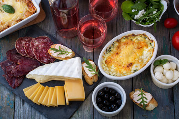 Board with delicacies. Top view