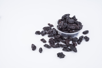 Concept Sweet dry raisins black and yellow isolated on the white background