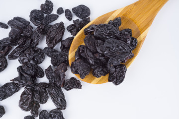 Concept Sweet dry raisins black and yellow isolated on the white background