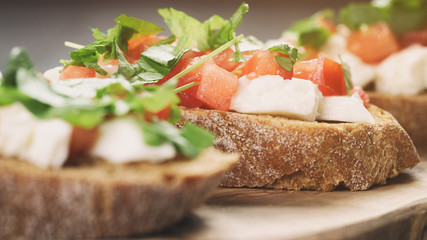 rye bruschetta with mozzarella, tomatoes and parsley