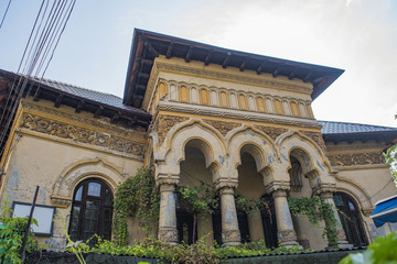 Old and abandoned building with valuable architecture in Bucharest, Romania.