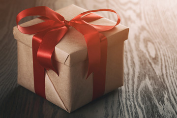rustic gift box with red ribbon bow