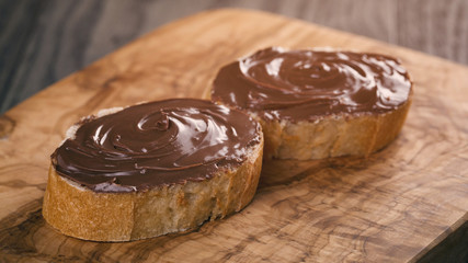 two baguette slices with chocolate hazelnut spread