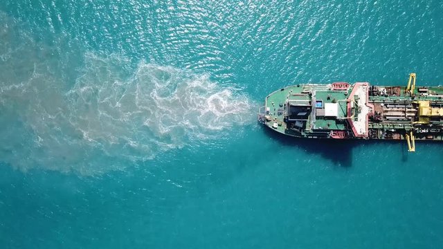 Suction-Dredger vessel at sea - Top down aerial footage