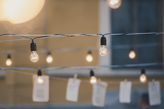 Light bulbs in a garden - summer party and culture concept