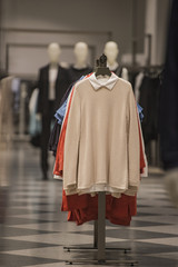 Fototapeta premium Women clothing on racks in a fashion store