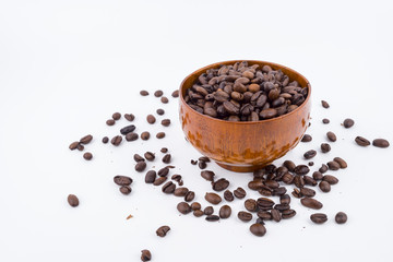 Concept roasted coffee beans in wooden bowl with isolated white background