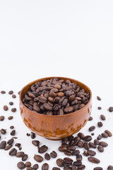 Concept roasted coffee beans in wooden bowl with isolated white background