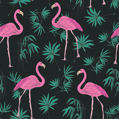 Elegant exotic seamless pattern with gorgeous pink flamingo birds and green tropical palm leaves hand drawn on dark background. Vector illustration for wallpaper, textile print, wrapping paper.