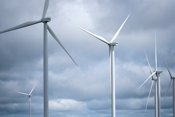 Fototapeta premium Windmill or turbine for electrical generator with overcast sky from Khao Kho, Phetchabun, Thailand
