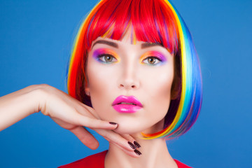 Naklejka premium beautiful woman wearing colorful wig