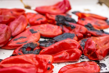 Close up baked of red peppers. Preparation of the winter. White background.