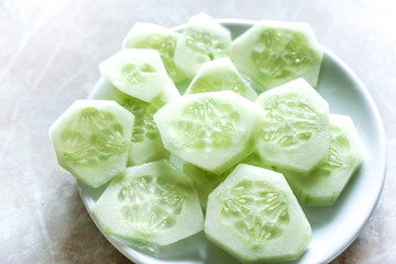 Fototapeta na wymiar Fresh Cucumber and slices white background.