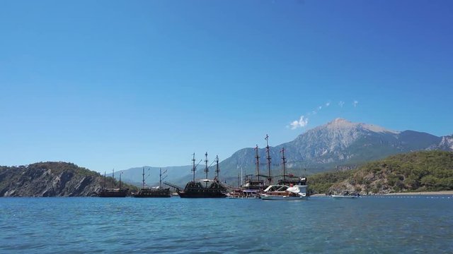 Touristic Galleons And Tour Boats Docked At Phaselis Beach, Antalya, Turkey