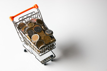 Shopping cart full of coins money