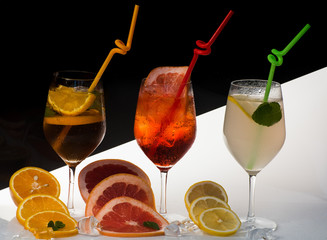 cocktail or colorful drink with fruit slices