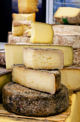 traditional hard cheese on a market stall in Italy