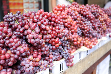 Fresh ripe grape store on the basket for sell at On Nut, Bangkok, Thailand