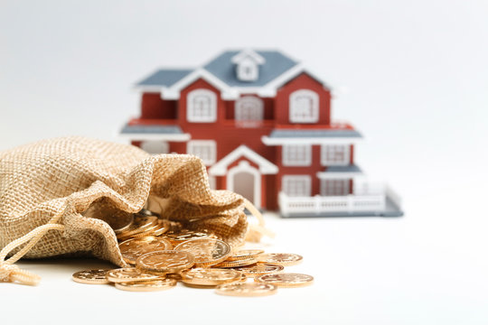 Money Bag And House Model On White Background