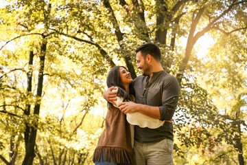 Young couple enjoying together in park. Loving couple in nature.