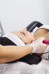 Woman having underarm Laser hair removal epilation