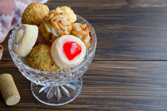  Panellets, typical sweets consumed at All Saints Day (Dia Todos Los Santos)  in Catalonia, Spain. Catalan small cakes or cookies background woth copyspace.