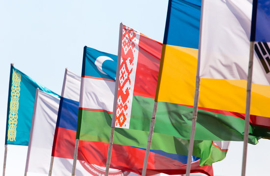 flags of different countries against the blue sky