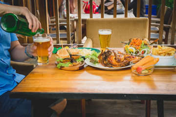 Fast food close up of fast food snacks and beer drink