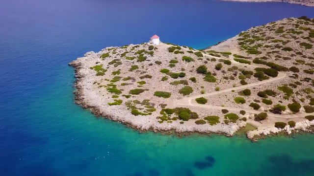 August 2017: Aerial drone video of iconic Archangel Michael of Panormitis bay in island of Symi, Dodecanese, Aegean, Greece
