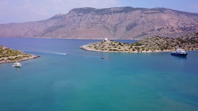 August 2017: Aerial drone video of iconic Archangel Michael of Panormitis bay in island of Symi, Dodecanese, Aegean, Greece