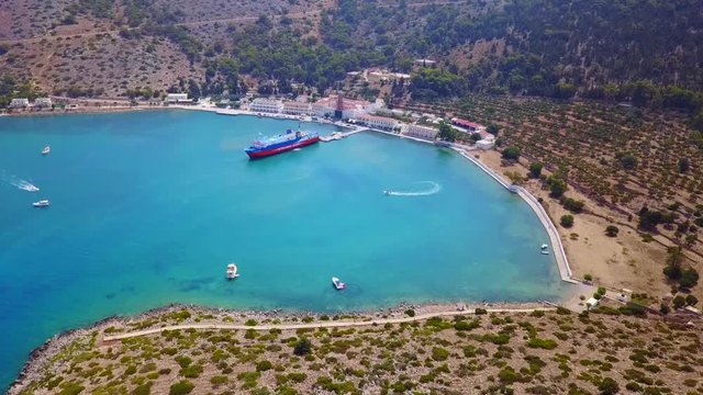 August 2017: Aerial drone video of iconic Archangel Michael of Panormitis bay in island of Symi, Dodecanese, Aegean, Greece