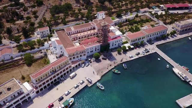 August 2017: Aerial drone video of iconic Archangel Michael of Panormitis bay in island of Symi, Dodecanese, Aegean, Greece