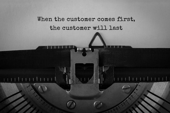 Text When the customer comes first the customer will last typed on retro typewriter