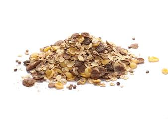 Crunchy chocolate muesli pile isolated on white background