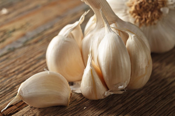 Garlic on wooden table.
