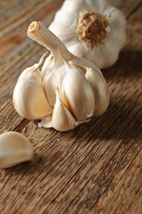 Garlic on wooden table.