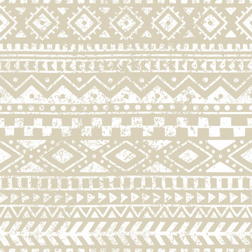 Seamless geometric pattern. Print for your textile. Ethnic and tribal motifs. Gray and white ornament. Grungy texture.