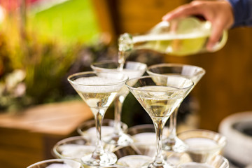 Pouring champagne into glasses