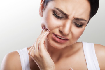 Teeth Problem. Woman Feeling Tooth Pain. Closeup Of A Beautiful Sad Girl Suffering From Strong...