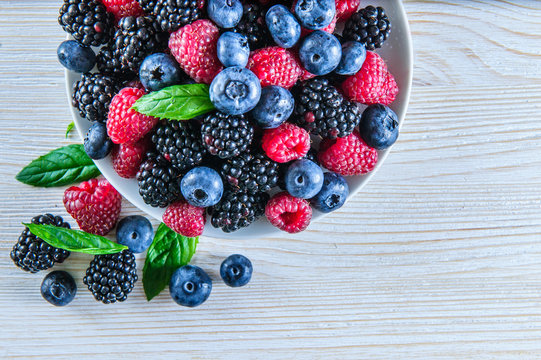 Various fresh summer berries,blueberries, raspberries and black berries shot from above