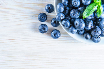 Blueberries with leaves in white background
