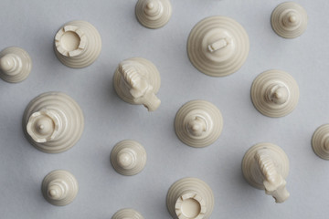 Chess game pieces on a grey background. Strategy concept