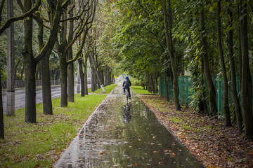 Bicycle hike in rainy autumn weather