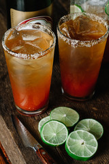Brunch Micheladas in tall glasses with salted rim