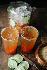 Brunch Micheladas in tall glasses with salted rim