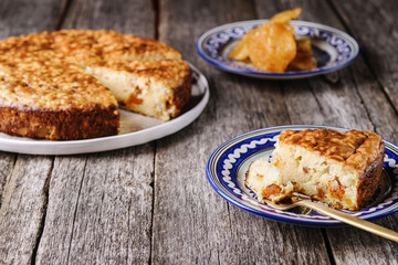 Rice pie cake with dried fruit on a vintage wooden table. Selective focus 