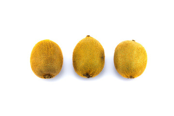 Three whole kiwi fruit on white ground