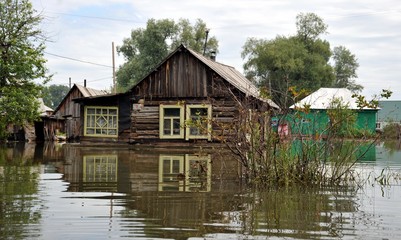 Fototapeta na wymiar Flood. The river Ob, which emerged from the shores, flooded the outskirts of the city.